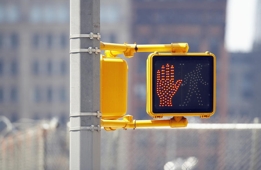 Do not cross sign on traffic lights, close-up Photograph by Thomas Northcut
