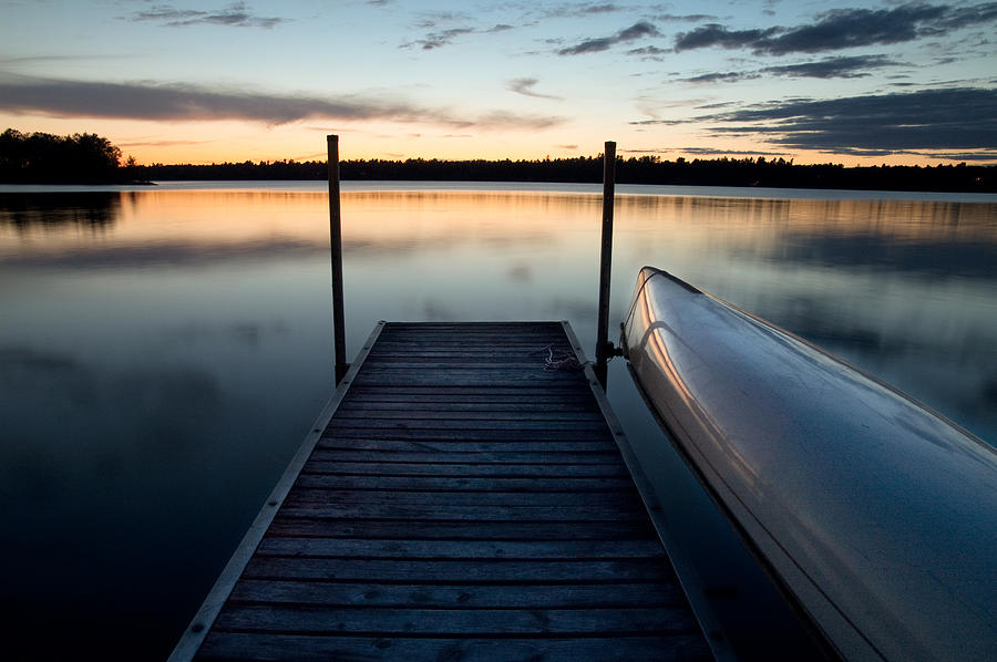 Dock at dusk on Black Lake Photograph by Rob Huntley