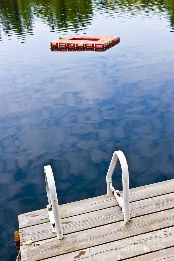 Lake and dock in cottage country Photograph by Elena Elisseeva