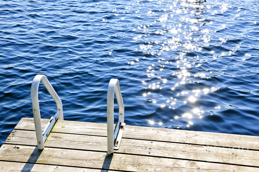 Dock on summer lake with sparkling water 2 Photograph by Elena Elisseeva