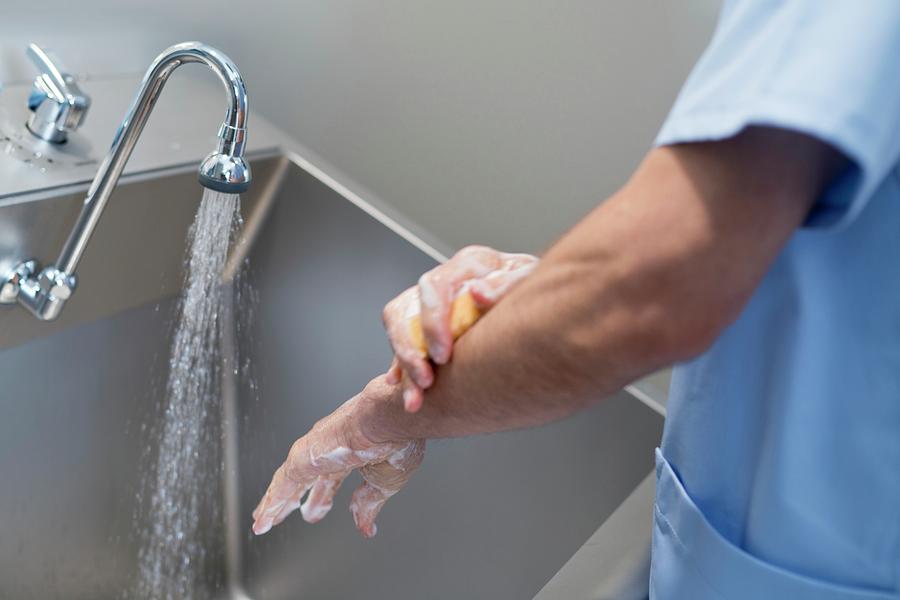 Doctor Cleaning Hands With Soap And Water Photograph by Science Photo ...