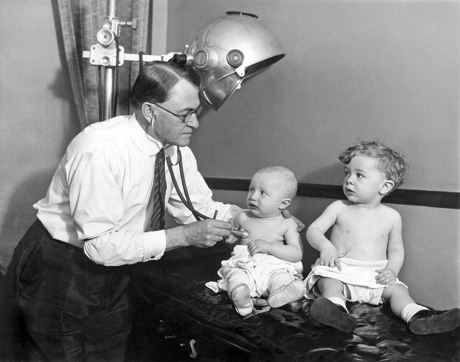 Doctor Examines Baby Photograph by Underwood Archives