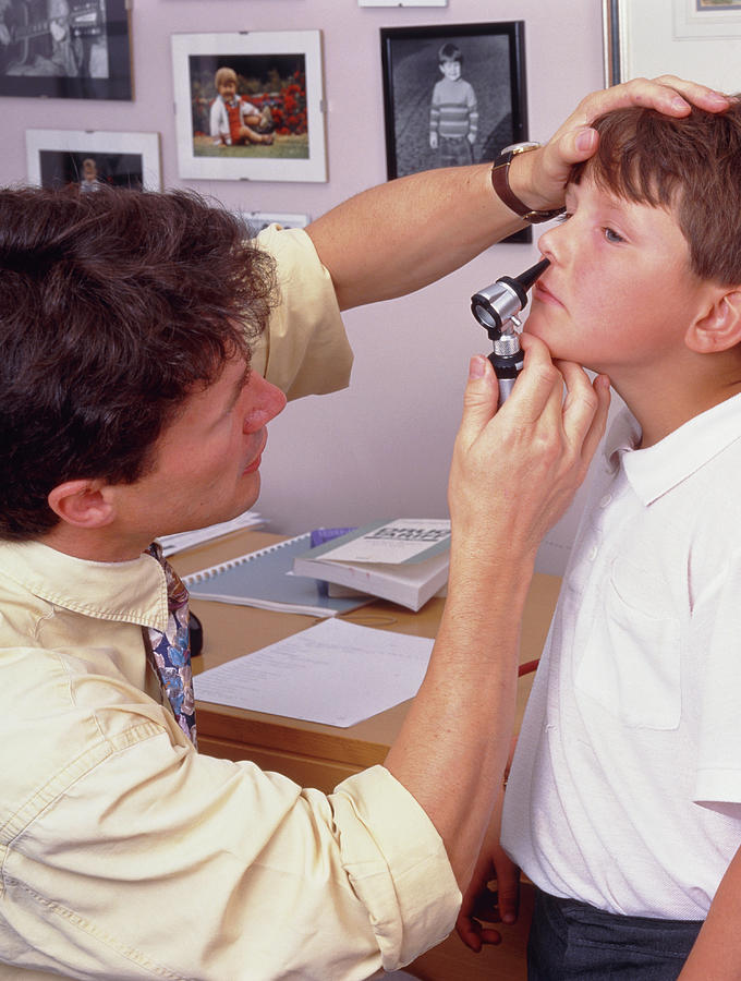 Doctor Examines Boys Nose With Otoscope Photograph by Simon Fraser/science Photo Library