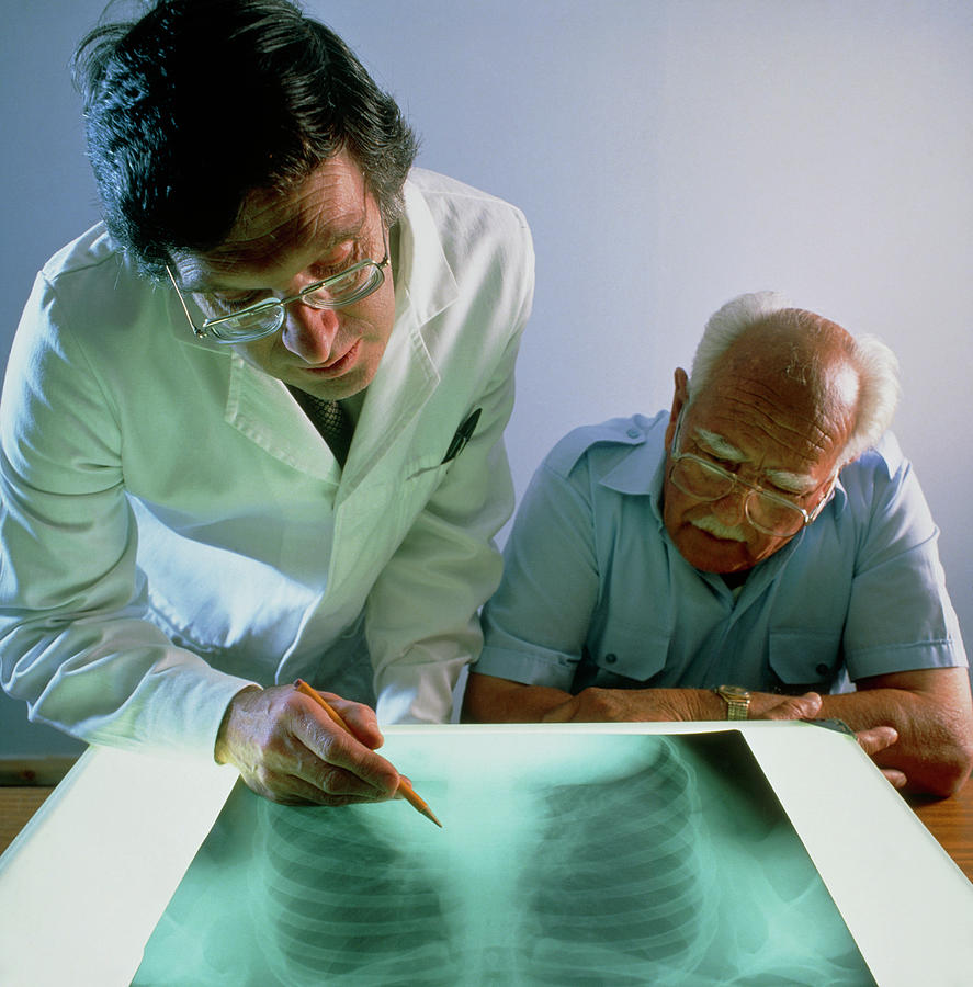 Doctor Explains An X-ray Photograph by Sheila Terry/science Photo Library Doctor Explains An X-ray Photograph by Sheila Terry/science Photo Library