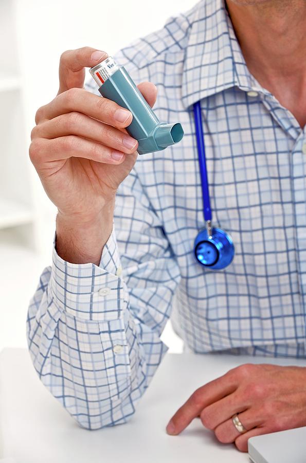 Doctor Holding An Asthma Inhaler Photograph by Lea Paterson/science Photo Library Fine Art America