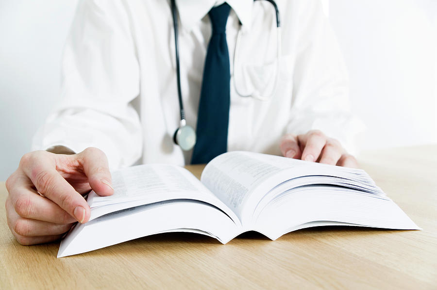 Reference Book Photograph - Doctor Reading by Gustoimages/science Photo Library
