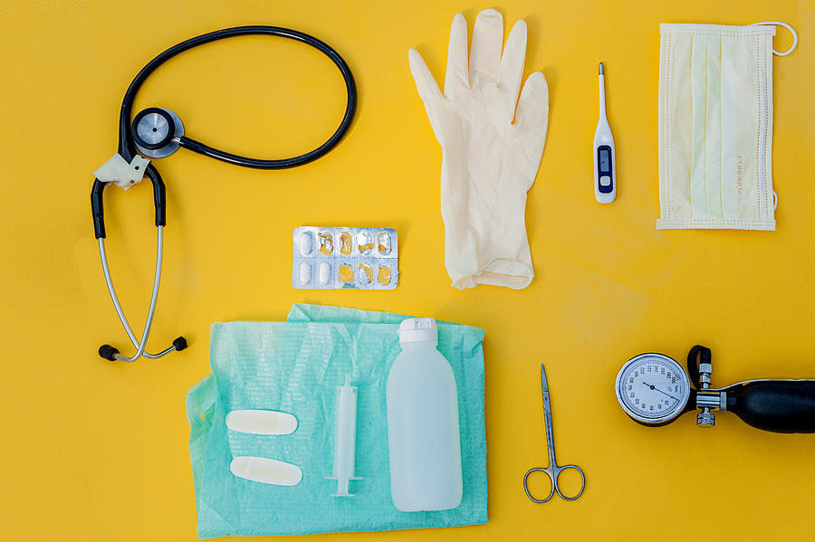 Doctor table with medical items. Flat lay Photograph by Carol Yepes