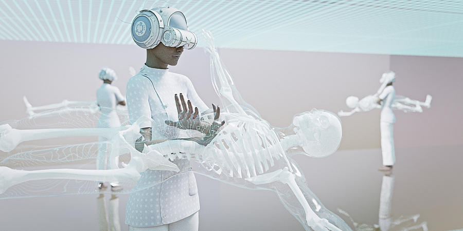 Doctors wearing virtual reality goggles examining skeleton Photograph by Donald Iain Smith