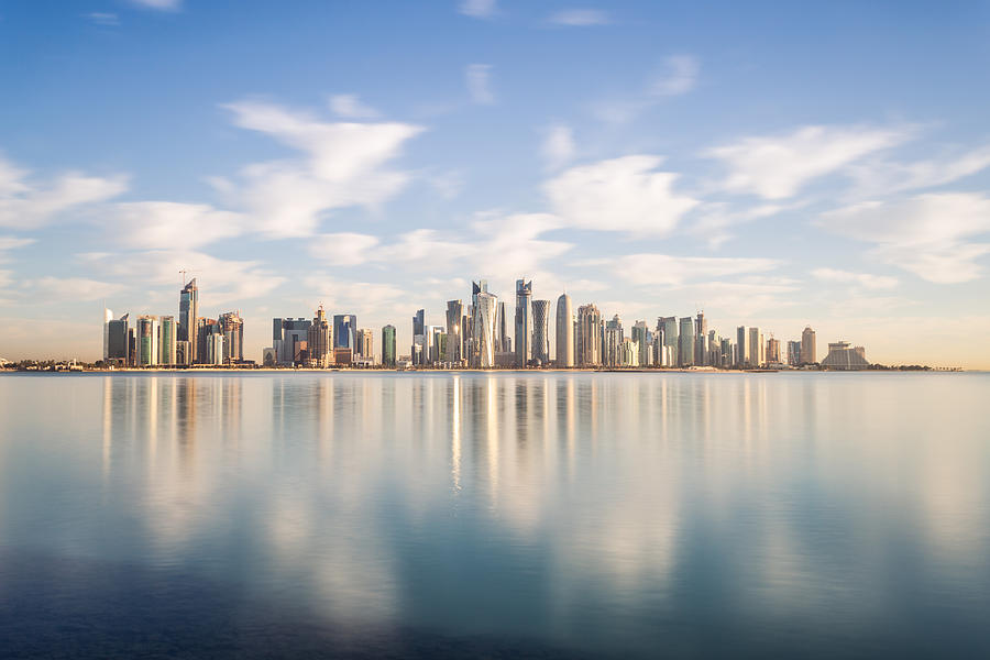 Doha modern city reflected in the sea, Qatar Photograph by Matteo Colombo