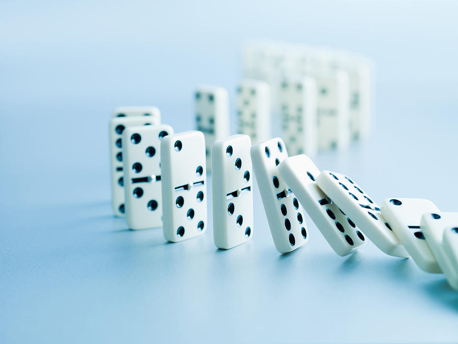 Dominoes falling in a row Photograph by Martin Barraud