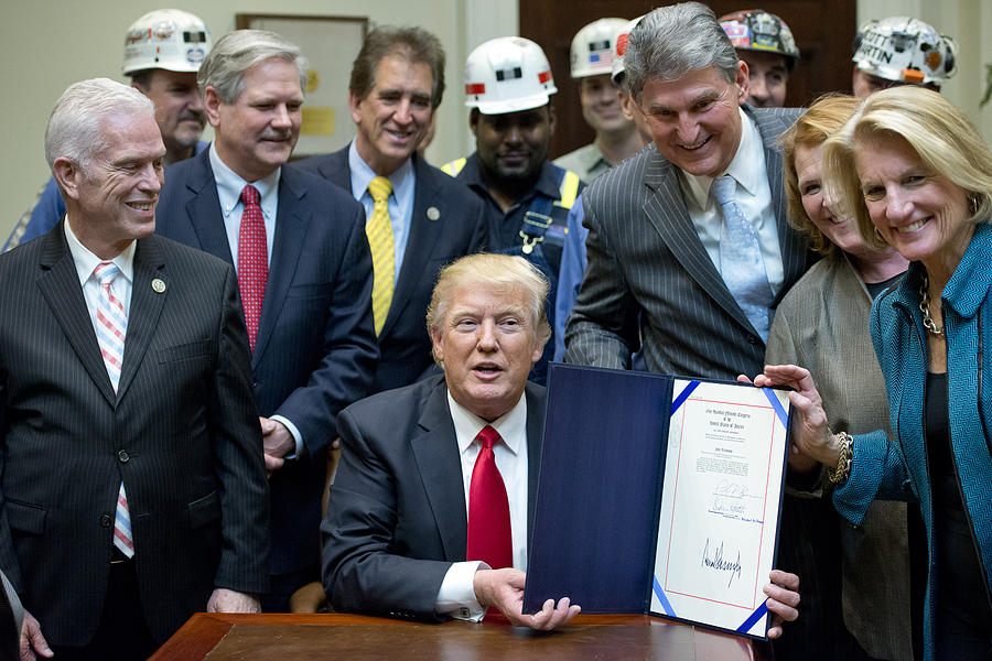 Donald Trump Sign Bill Eliminating Regulations On The Mining Industry Photograph by Pool Donald Trump Sign Bill Eliminating Regulations On The Mining Industry Photograph by Pool