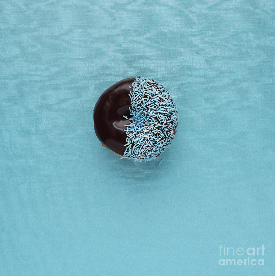 Donut Photograph - Donut With Chocolate Icing And Blue Sprinkles On Blue Background by Gillian Vann