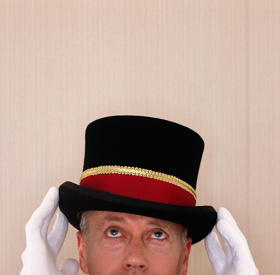 Doorman adjusting top hat, high section Photograph by Max Oppenheim