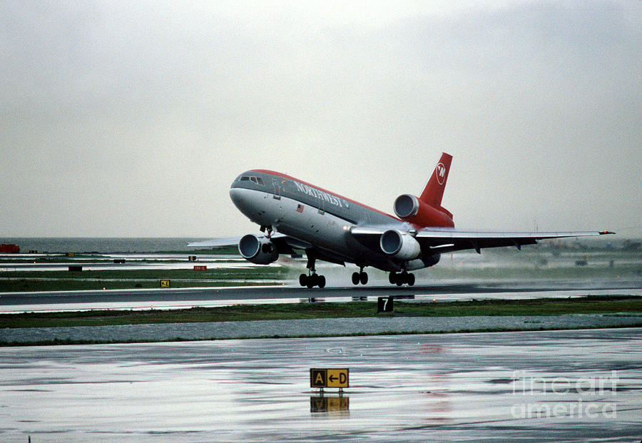 Douglas DC-10-40 Taking Off in the Rain Photograph by Wernher Krutein