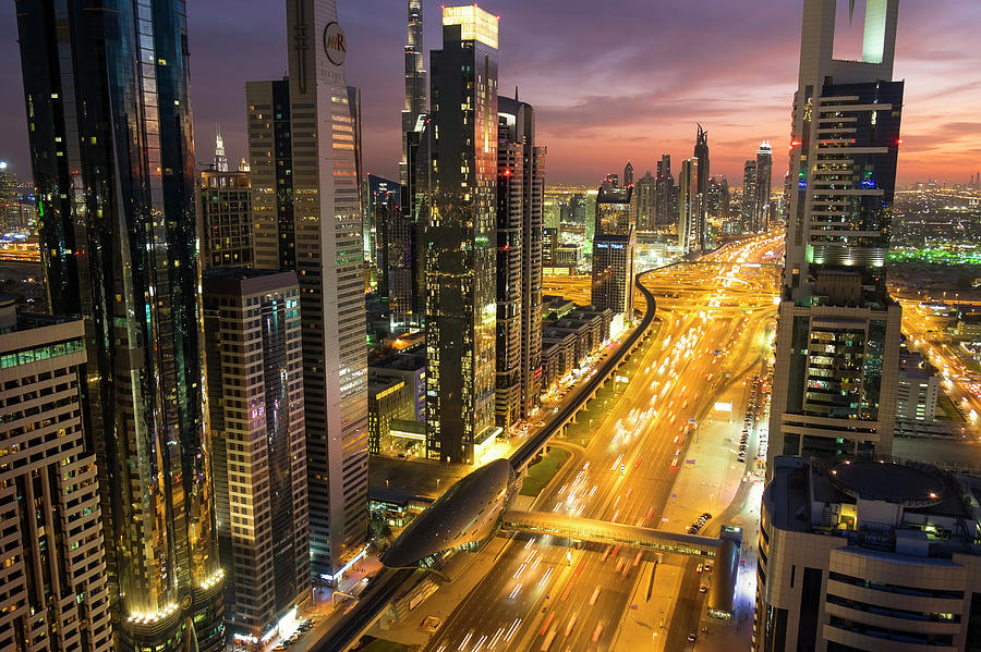 Downtown And Sheikh Zayed Road At Dusk Photograph by Peter Adams