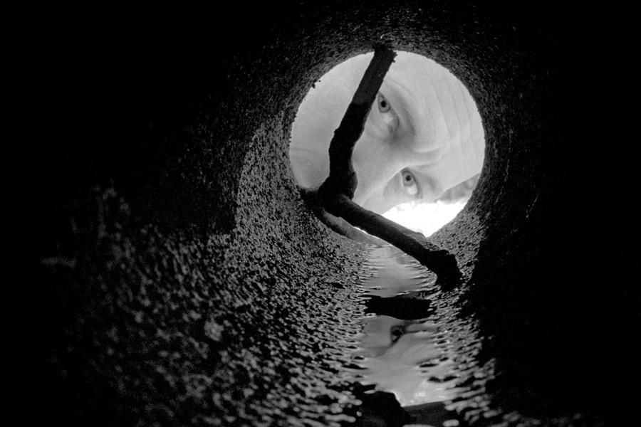 Black And White Photograph - Drain Pipe - Artist Self Portrait by Gary Heller