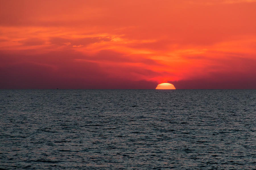 Dramatic Red Sky With The Sun Setting Photograph by John Short