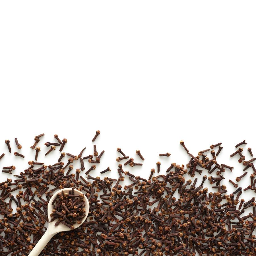 Dried Cloves And White Spoon Photograph by Science Photo Library