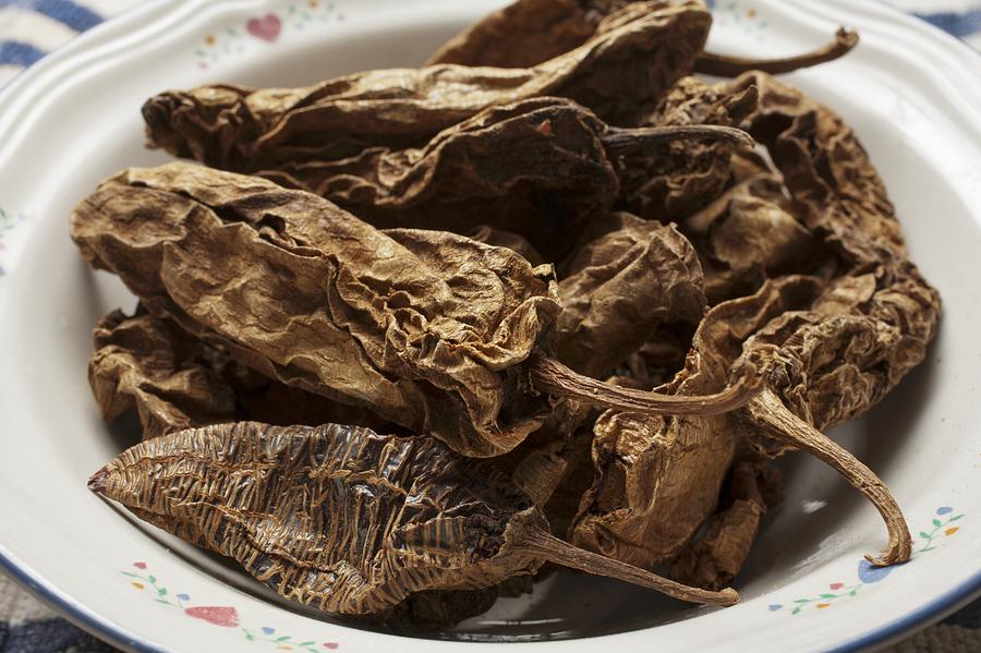 Dried Whole Chipotle Peppers in a Bowl Photograph by StockFood Dried Whole Chipotle Peppers in a Bowl Photograph by StockFood