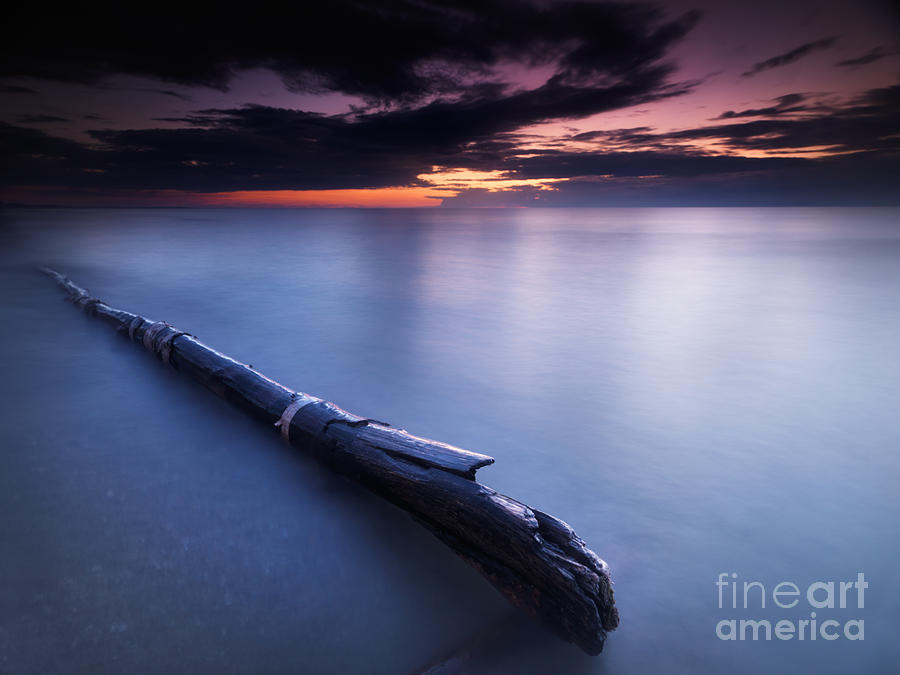 Driftwood in dramatic sunset scenery at lake Huron Grand Bend Photograph by Maxim Images Exquisite Prints