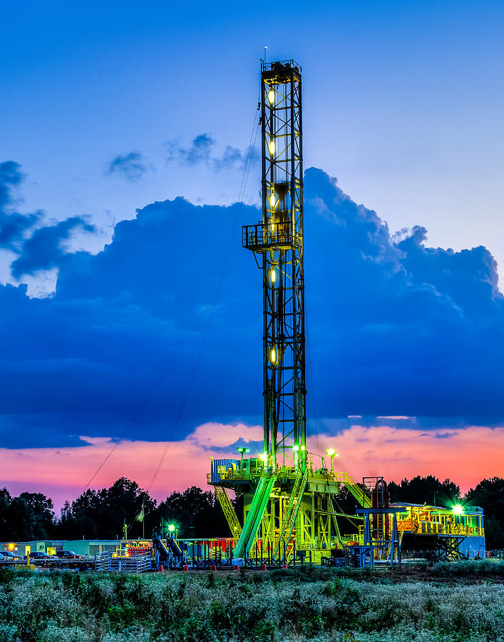 Oil Rig Photograph - Drilling into the night by Geoff Mckay