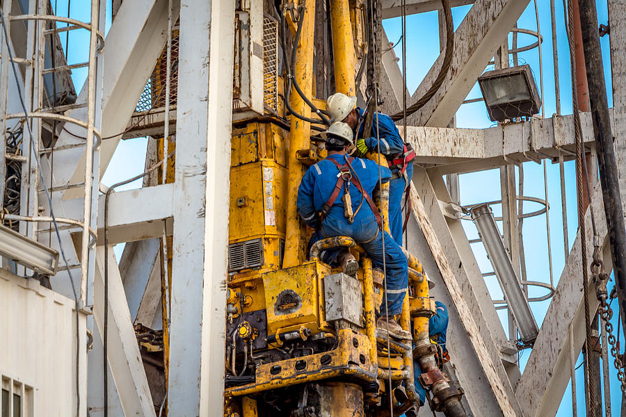 Drilling rig workers Photograph by Sasacvetkovic33