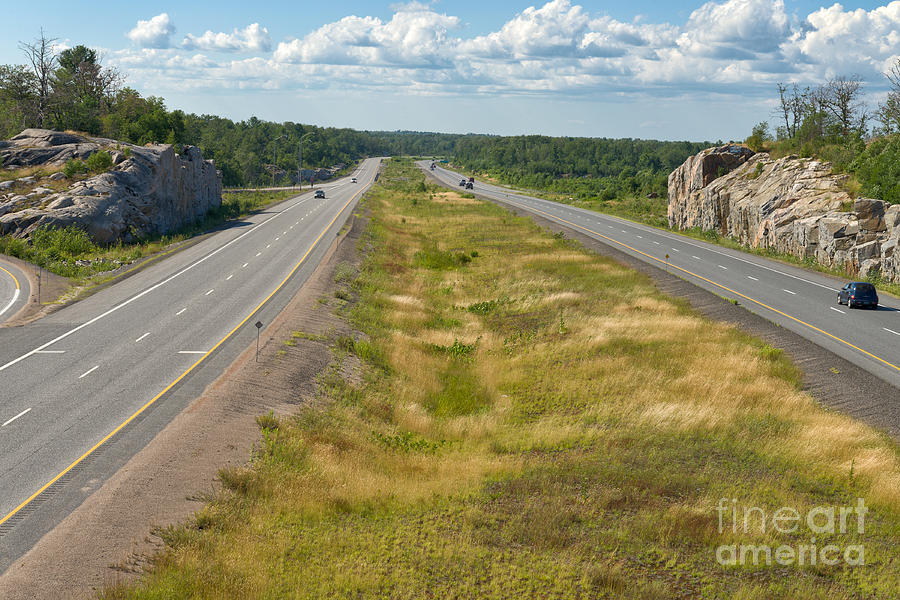 Driving north through Canadian Shield Country Photograph by Les Palenik