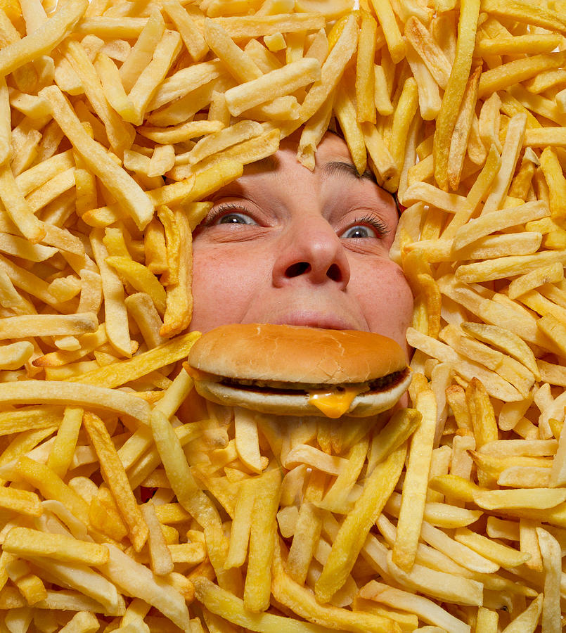 Drowning in junk food Photograph by Fontina