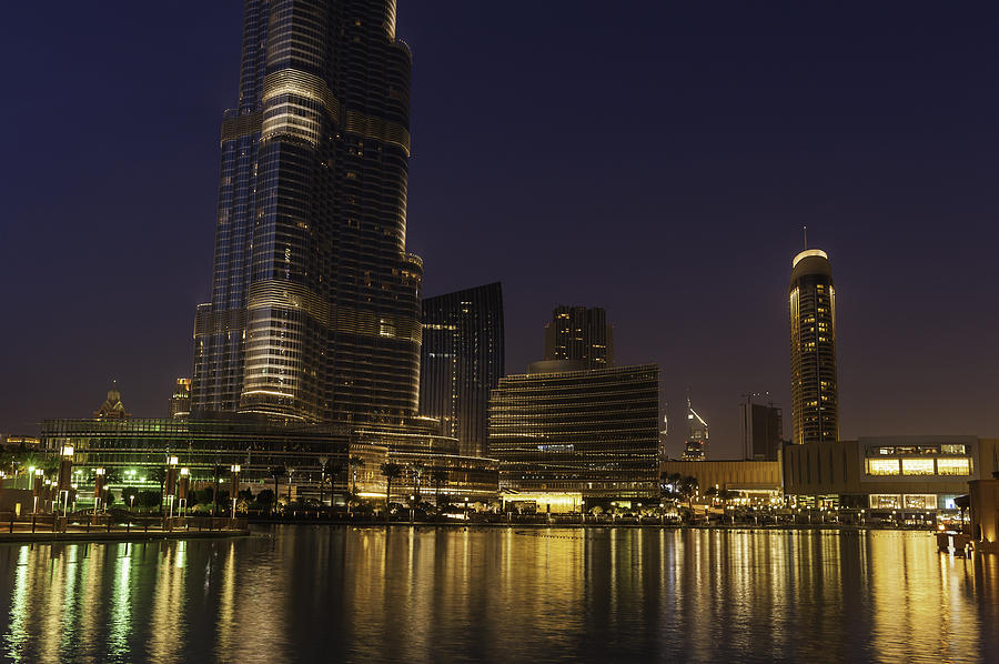 Dubai downtown lights shining in blue dusk UAE Photograph by fotoVoyager