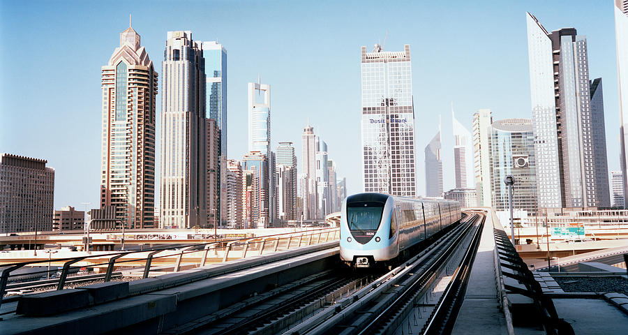 Dubai Metro Train Passing Through The Photograph by Gary Yeowell