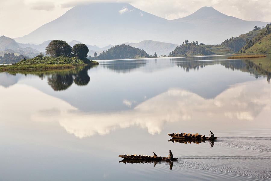 Dugout Canoe Floating On Lake Mutanda Photograph by Martin Zwick