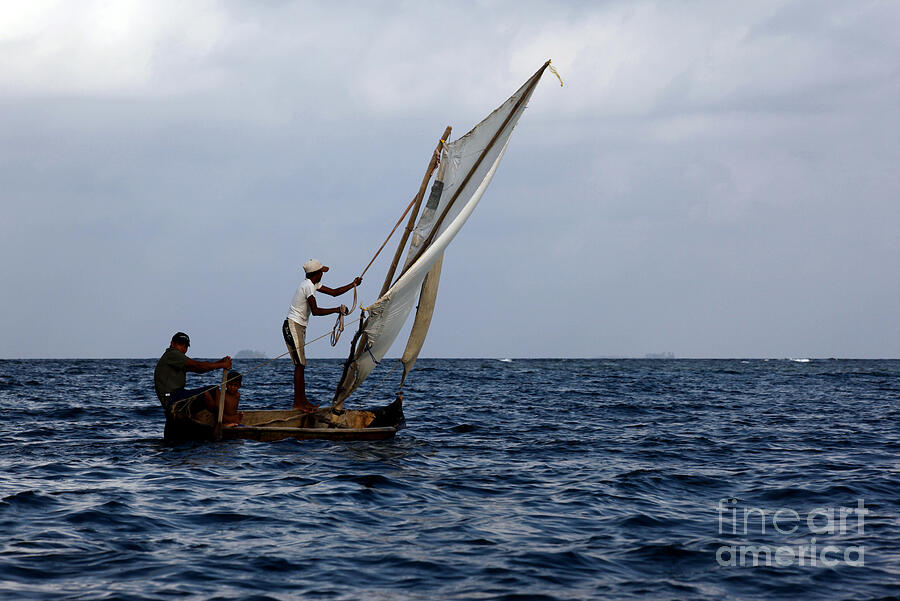 Kuna Indians sailing a dugout canoe Panama Photograph by James Brunker