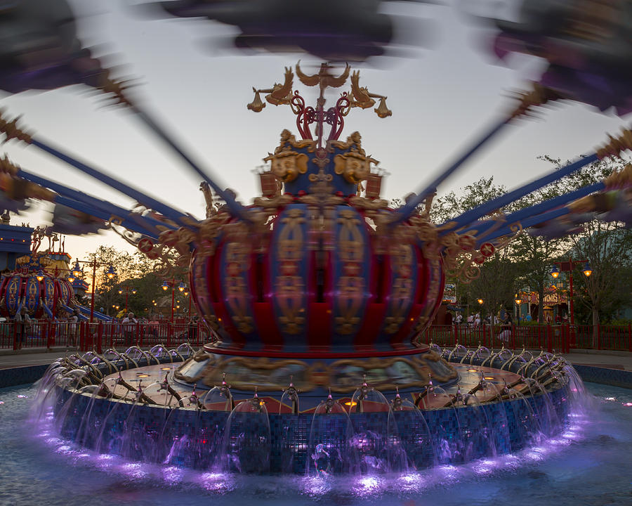 Architecture Photograph - Dumbo the Flying Elephant ride at dusk by Adam Romanowicz
