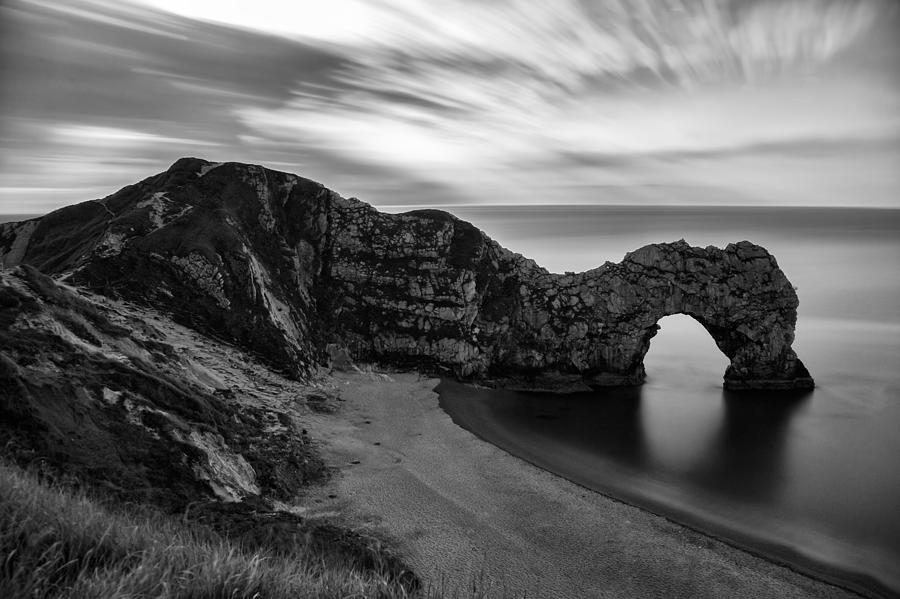 Durdle Door in black and white Photograph by Ian Middleton