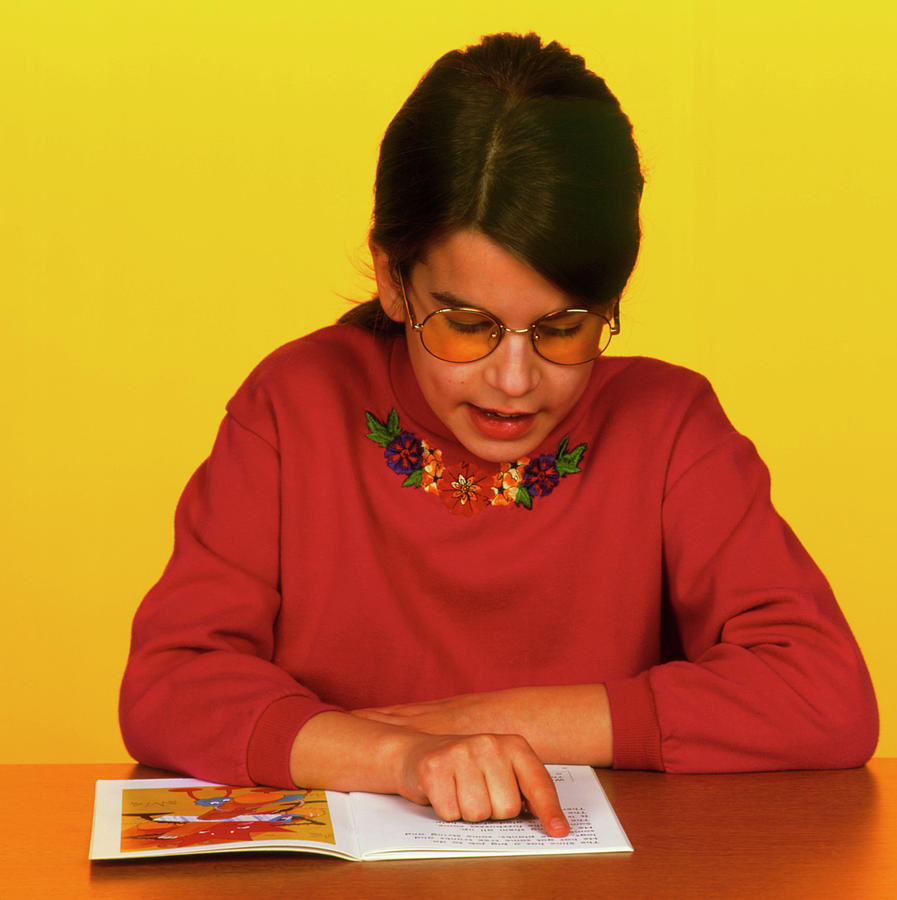 Dyslexia Photograph - Dyslexic Girl Wears Irlen Lenses To Read A Book by Alex Bartel/science Photo Library