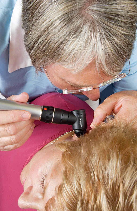 Device Photograph - Ear Examination by Jim Varney/science Photo Library