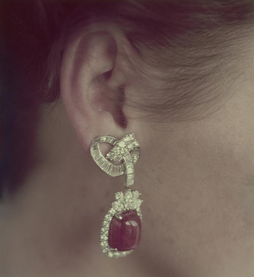 Ear Of A Model With A Ruby Earring Photograph by Richard Rutledge