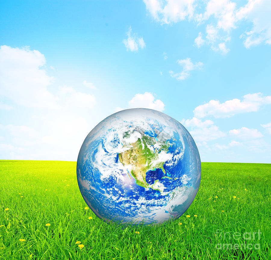 Earth globe on green grass Photograph by Michal Bednarek