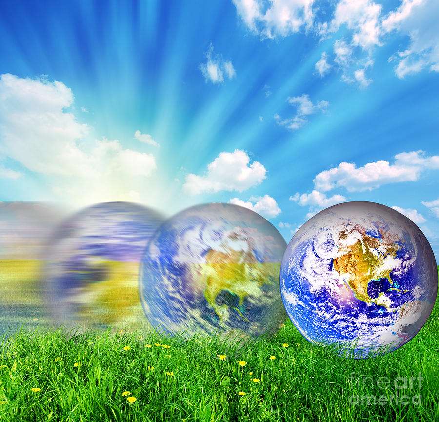 Holiday Photograph - Earth globe rolling on green grass by Michal Bednarek
