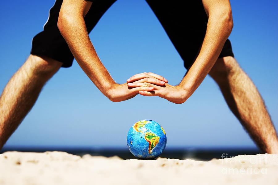 Earth globe with hands over it. Conceptual image Photograph by Michal Bednarek