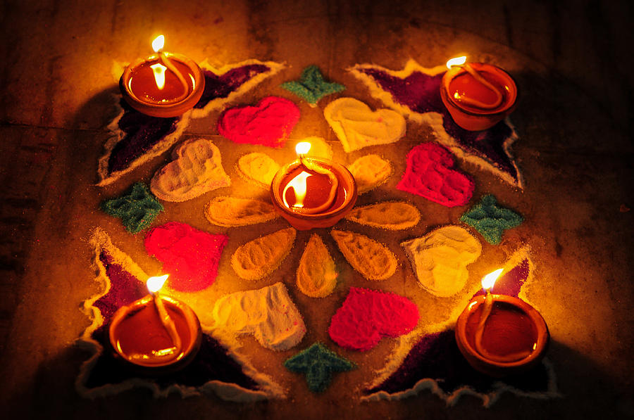 Earthen lamps and Rangoli decoration on floor for Diwali festival Photograph by Copyrights @ Arijit Mondal