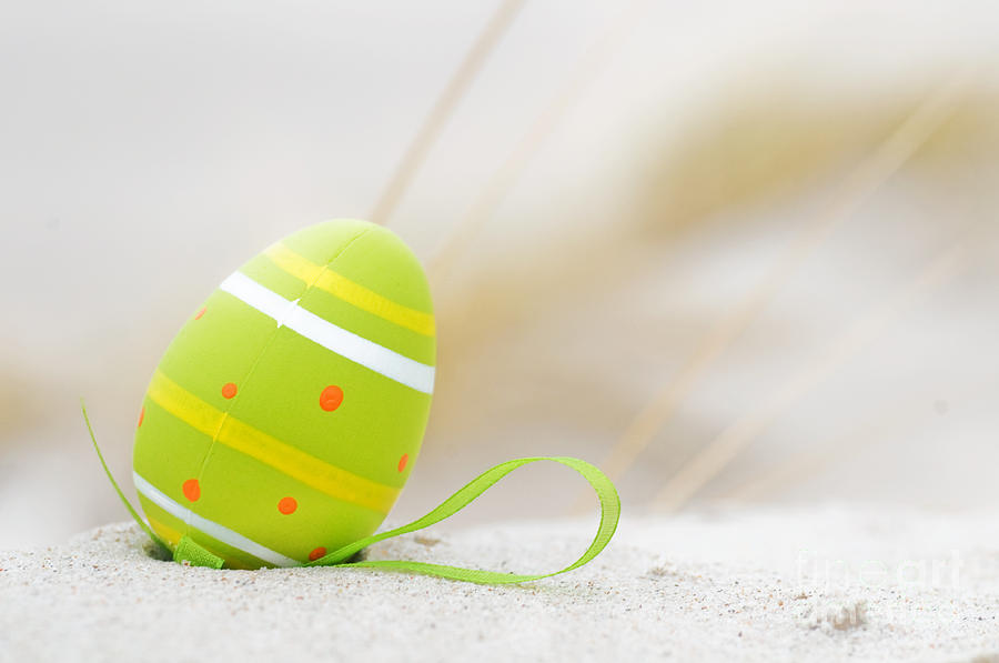 Easter Photograph - Easter decorated egg on sand by Michal Bednarek