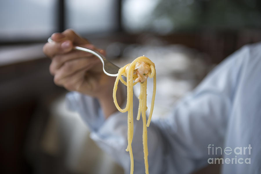 Eating spaghetti Photograph by Mats Silvan