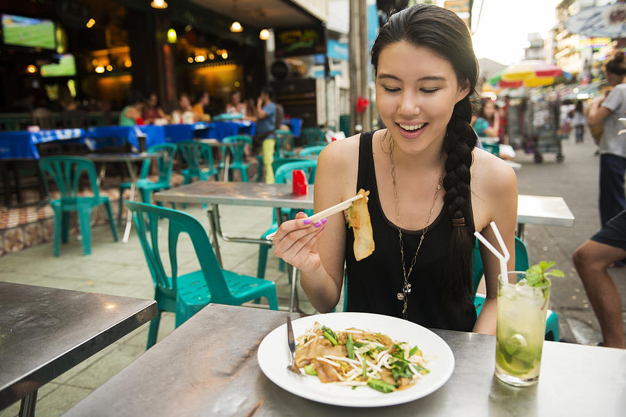 Eating Thai Food on Khao San Road Bangkok Thailand Photograph by Boogich