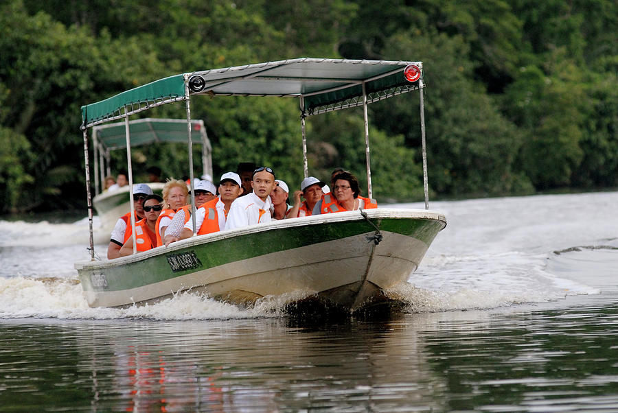 Ecotourists On A Boat Trip Photograph by Sinclair Stammers/science Photo Library