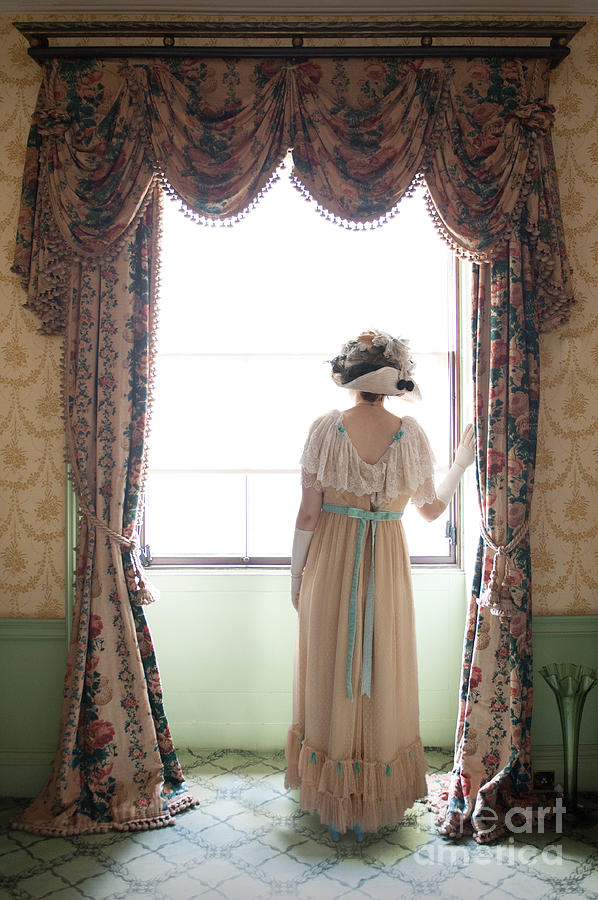Edwardian Woman Looking Out Of A Window Photograph by Lee Avison