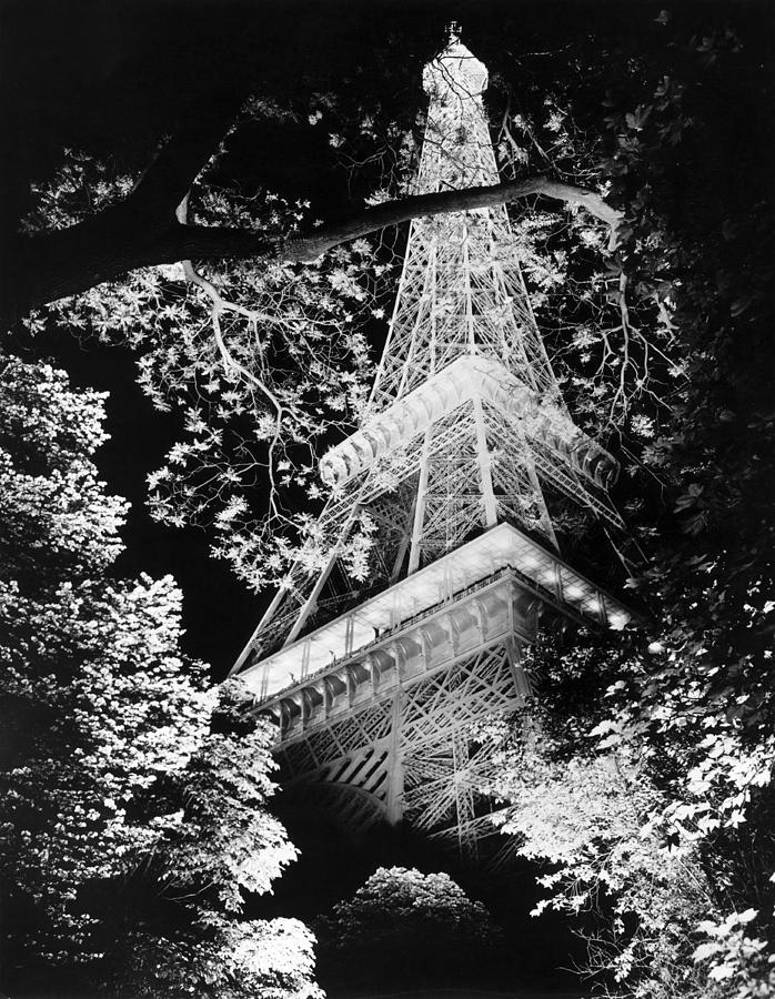 Eiffel Tower Photograph - Eiffel Tower At Night by Underwood Archives