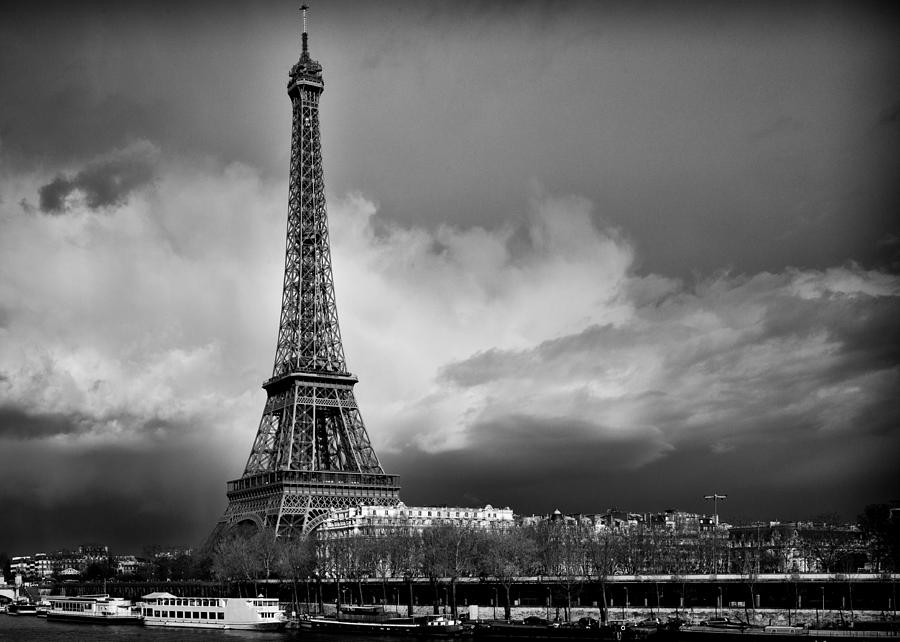 Eiffel Tower in dramatic sky, black & white Photograph by Vadim Krisyan