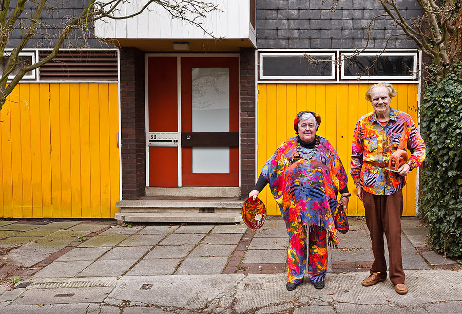 Elderly Couple in eccentric outfits Photograph by Anne Clements