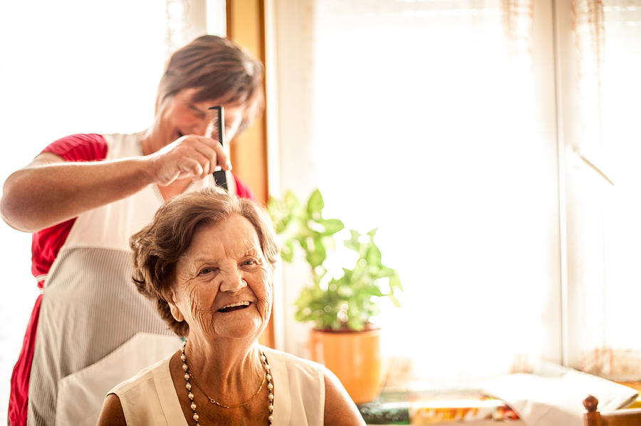 Elderly Home care service by a Caregiver Photograph by CasarsaGuru